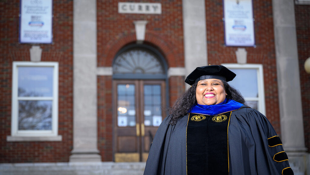 Ashley Devon Smith in graduation regalia